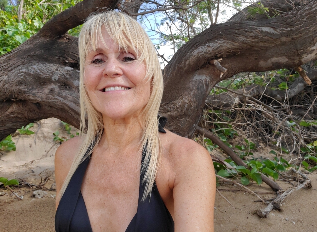 Brenda Lee Eichelberger smiling outdoors on Maui